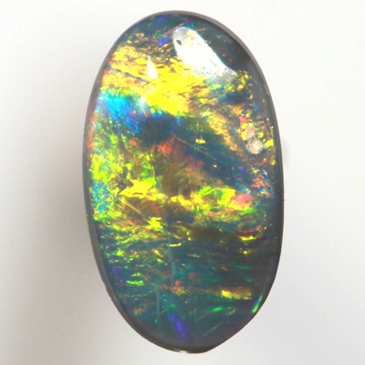 SOLID BLACK OPAL Bright neon golds, yellow and red over blue